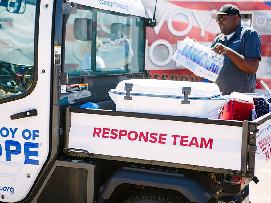 Disaster relief teams deliver aid.