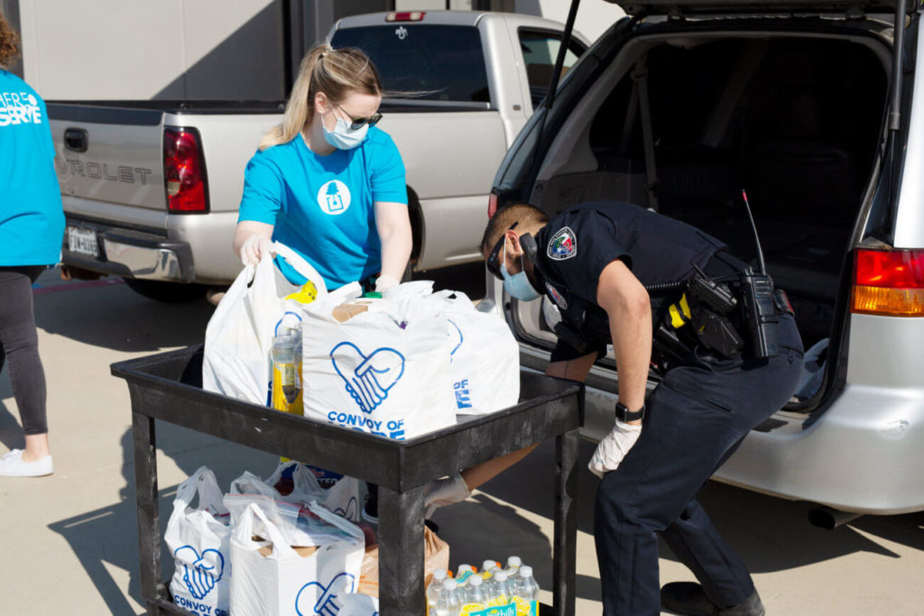 Red Oak, Texas – In response to the COVID-19 pandemic, volunteers at The Oaks Church load relief supplies, food, water, and cleaning supplies into vehicles