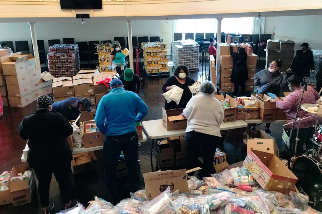 Tacoma, Washington – Volunteers at Surehouse Open Bible Church sort and pack relief supplies to distribute to their community.