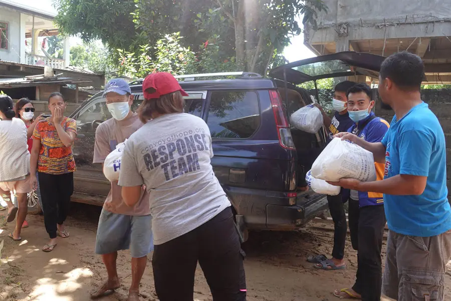 Convoy staff delivering response supplies.