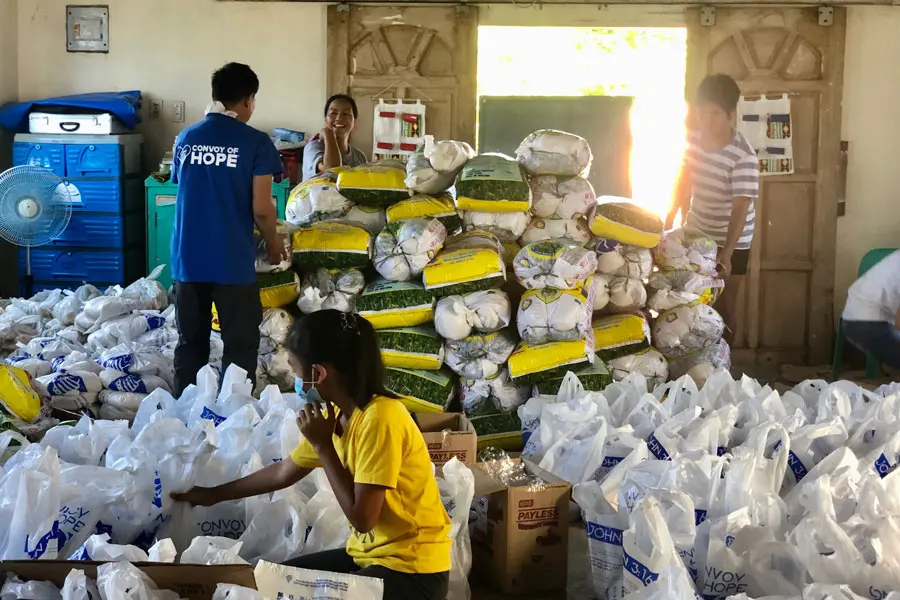Convoy of Hope staff and volunteers pack relief supplies to deliver to those affected by recent Typhoons in the Philippines.