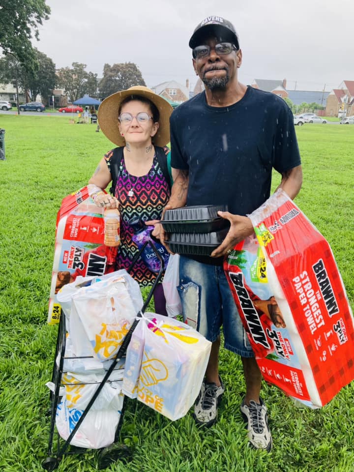 A family receives nonperishable supplies from Convoy of Hope.