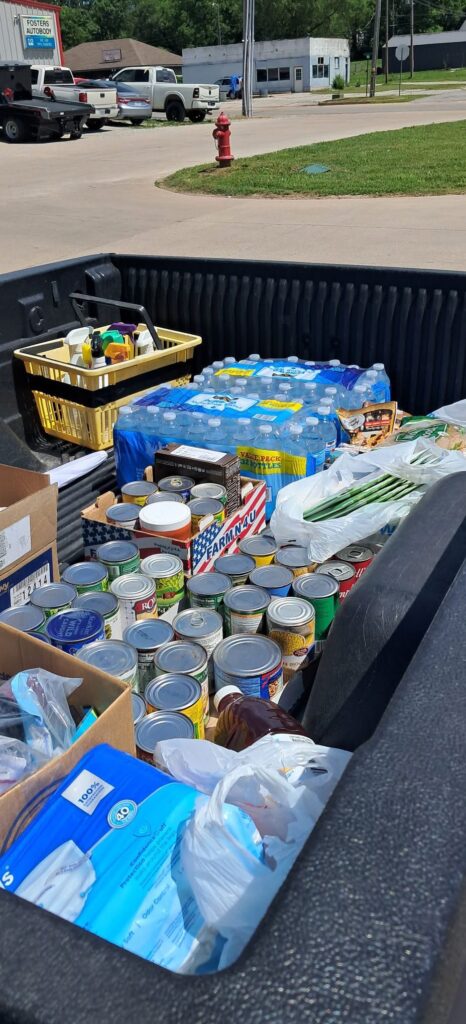 A truckbed full of nonperishable supplies, ready to be stocked in the free pantry.